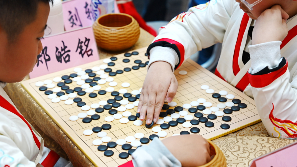 首届智运会热身赛已“落子”，每周末到龙贵购物广场“棋逢对手”