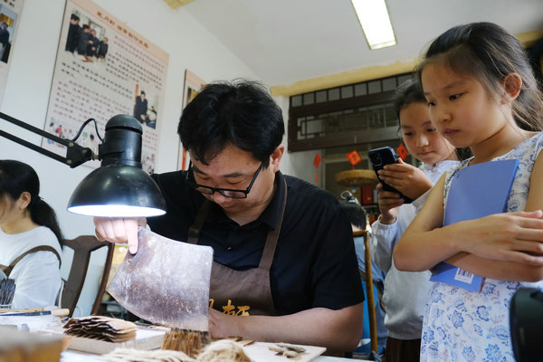 Summer camp children get brushed by ink tradition
